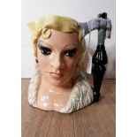 A LARGE ROYAL DOULTON MAE WEST CHARACTER JUG