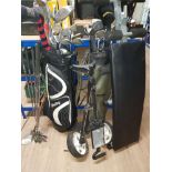 A LARGE QUANTITY OF GOLD CLUBS 2 GOLF BAGS AND A WEIGHT BENCH