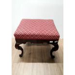 AN ANTIQUE MAHOGANY STOOL WITH SCROLL FEET NA