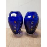 A PAIR OF BLUE COLOURED GLASS VASES WITH FLORAL DECORATION