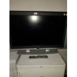 A 32 INCH ADVENT TV WITH REMOTE