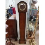 A GRANDDAUGHTER CLOCK WITH BRASS DIAL AND KEY