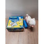 A BOXED VINTAGE BATTERY OPERATED REMOTE CONTROL ROARING WALKING BEAR