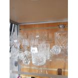 A LARGE QUANTITY OF CRYSTAL CUT GLASS INCLUDING A SILVER PLATED TOPPED WHISKY DECANTER ETC