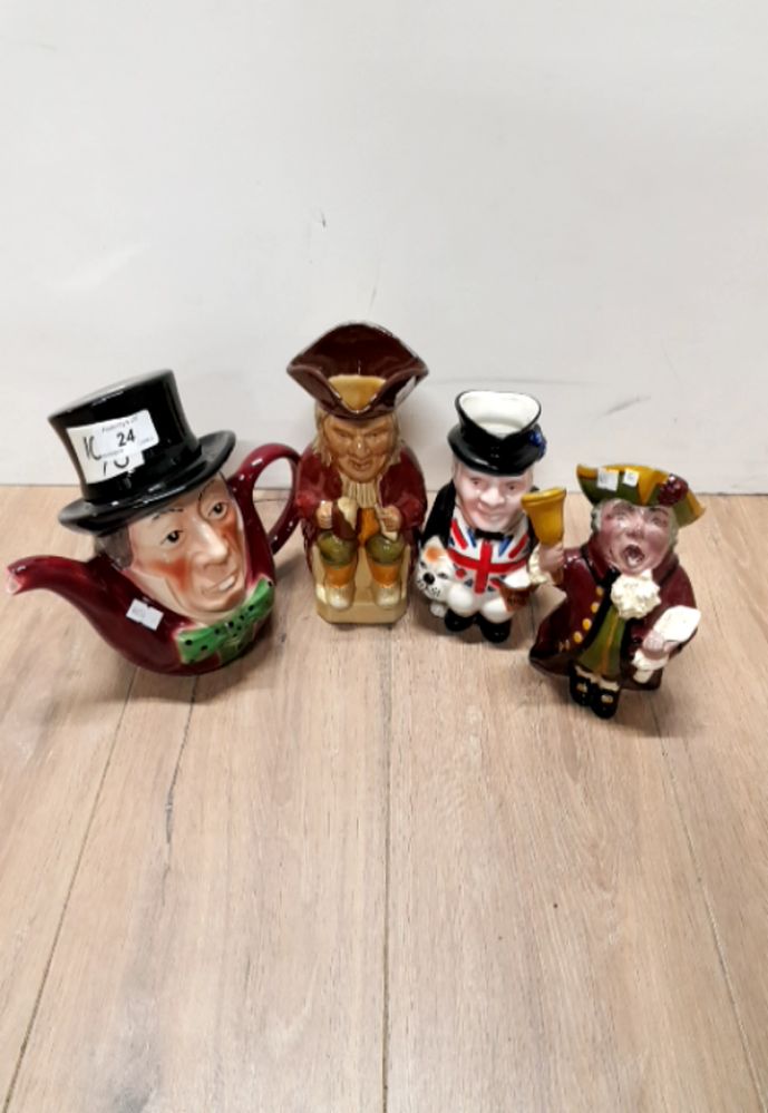 A MAD HATTER TEAPOT AN THREE TOBY JUGS INCLUDING THE TOWN CRIER ETC