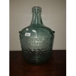 A LARGE CARBOY WITH BASKET WEAVE MOULDING