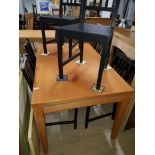 A MODERN DINING TABLE AND 6 BLACK CHAIRS