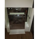 A BATHROOM MIRRORED WALL UNIT WITH BATHROOM MIRRORED SHELF