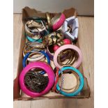 A BOX OF COSTUME BANGLES