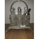 A VINTAGE GLASS AND SILVER PLATED CRUET SET