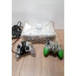 A LIMITED EDITION XBOX CRYSTAL PLUS TWO CONTROLLERS