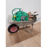 GARDEN WHEELBARROW WITH GARDEN TOOLS AND HOSE ON REEL