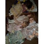 A SUBSTANTIAL AMOUNT OF PORCELAIN HEADED DOLLS