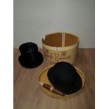 A VINTAGE TOP HAT IN FANTASTIC CONDITION AND A BOWLER HAT TOGETHER WITH A LINCOLN BENNETT HAT BOX