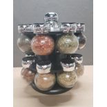 REVOLVING SPICE RACK CONTAINING 16 DIFFERENT SPICES