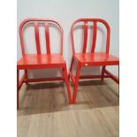 A PAIR OF PAINTED RED WOODEN CHAIRS