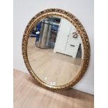 GILT FRAMED OVAL SHAPED MIRROR