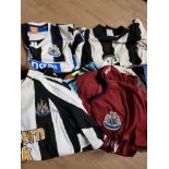 A SUBSTANTIAL AMOUNT OF NEWCASTLE FOOTBALL SHIRTS