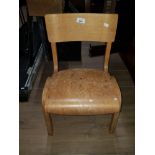 A VINTAGE WOODEN KIDS CHAIR