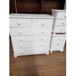 A PAIR OF PAINTED PINE 3 DRAWER BEDSIDE UNITS AND A 2 OVER 4 DRAWER CHEST