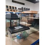 A HAMSTER CAGE WITH GLASS BOTTOM AND 2 ASSORTED SIZED AQUARIUMS