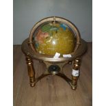 A GEM STONE WORLD GLOBE WITH FITTED COMPASS