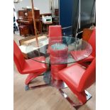 A ROUND GLASS DINING TABLE AND PADDED STAND WITH 4 RED CHAIRS LEATHER ON CHROME Z FRAME