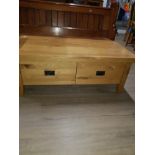 A SOLID OAK 2 DRAWER COFFEE TABLE
