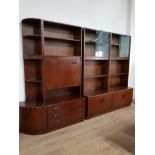 A MULTI WALL DISPLAY UNIT IN DARK MAHOGANY WITH SLIDING DOORS SHELVES CORNER SHELVES ETC