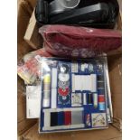 A BOX CONTAINING SEWING ACCESSORIES HOT WATER BOTTLE ETC