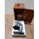 A MICROSCOPE IN A FITTED WOODEN BOX