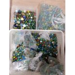 2 BOXES AND A LARGE BAG OF MARBLES