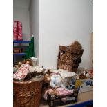 2 WICKER BASKETS AND A SUBSTANTIAL AMOUNT OF PORCELAIN HEADED DOLLS