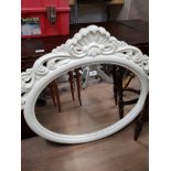 A MODERN ORNATE MIRROR