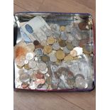 TIN CONTAINING A LARGE SELECTION OF FOREIGN COINS AND NOTES