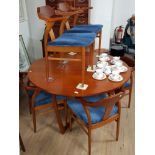 G PLAN CIRCULAR TOPPED DROPLEAF TABLE AND 6 MATCHING CHAIRS