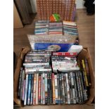 A BOX OF ASSORTED CDS AND DVDS