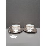 A PAIR OF LIMOGES PORCELAIN CUPS IN SILVER PLATED BASES