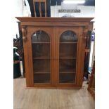 CARVED PINE BOOKCASE WITH DOUBLE GLAZED DOOR