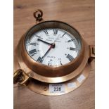 A SHIPS PORTHOLE CLOCK