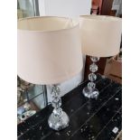 2 CRYSTAL EFFECT GLASS BASED TABLE LAMPS WITH CREAM SHADES
