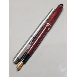 OSMIROID 65 ITALIC RED MARBLE COLOURED FOUNTAIN PEN TOGETHER WITH A BRUSHED STEEL PARKER PEN