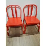 A PAIR OF MODERN RED CHAIRS