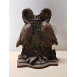 HEAVY CAST IRON DOOR STOP DECORATED WITH A PAIR OF BIRDS