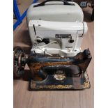 A VINTAGE SINGER SEWING MACHINE TOGETHER WITH ONE OTHER