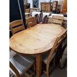 SUPERB OAK EXTENDING OVAL TABLE TOGETHER WITH 6 MATCHING UPHOLSTERED LADDER BACK CHAIRS