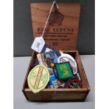 KING CORONA WOODEN BOX CONTAINING METAL AND STITCHED BADGES