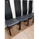 A SET OF 4 MODERN BLACK HIGH BACK POLYVINYL DINING CHAIRS