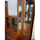 A MODERN CORNER DISPLAY CABINET WITH ETCHED GLASS DOORS AND A MATCHING DISPLAY CABINET