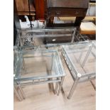 A CHROME BASED COFFEE TABLE WITH GLASS TOP AND 3 MATCHING SIDE TABLES